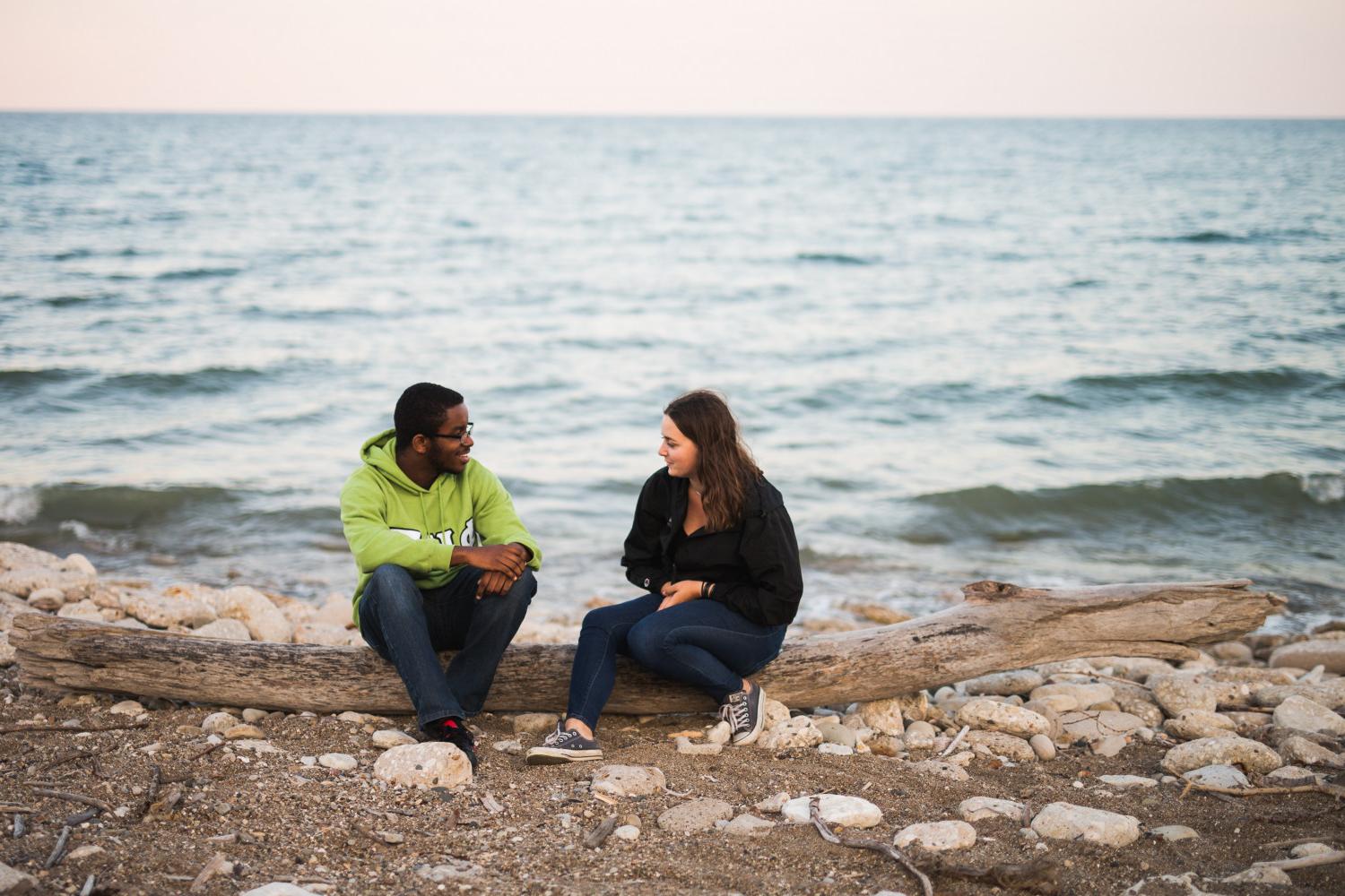 Two students hang out by the lake.