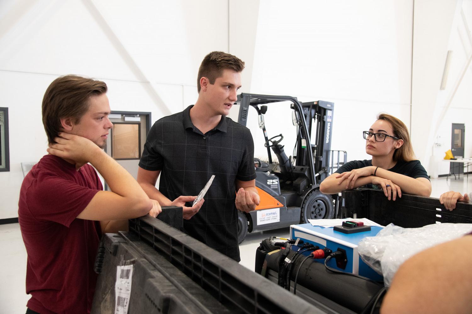 Carthage microgravity students and their Magneto-active Slosh Control (MaSC) experiment preparing for a Test Readiness Review prior to a ...